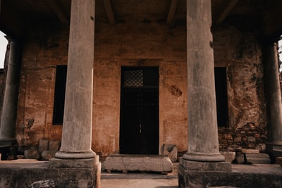 Two brown concrete column
